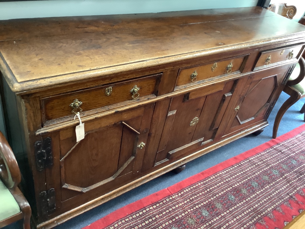 An 18th century oak low dresser, width 182cm depth 47cm height 89cm